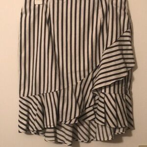 Black and white summer skirt with a symmetrical ruffleon the front ruffle